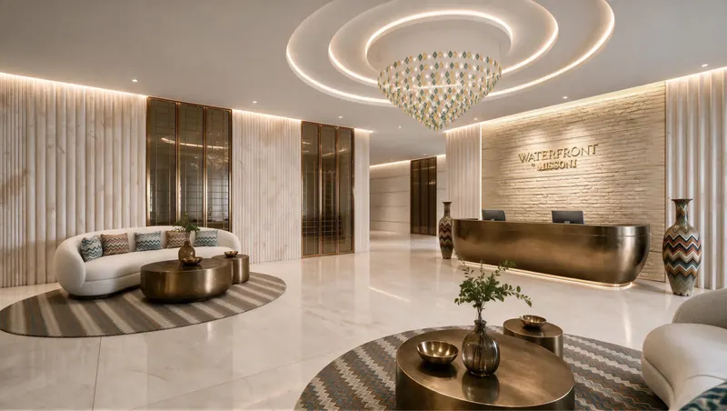 Double-height lobby in bronze and ivory with a sculptural chandelier